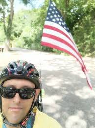 Riding bike in Defuniak Springs parade