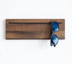 A wall storage classic, they are available in various sizes and can be combined, depending on your products, to accentuate any wall. Sunglass Holder Entryway Organizer Modern Sunglass Storage Etsy