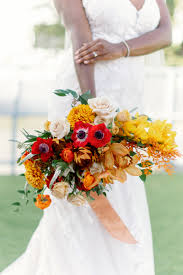 Maybe you would like to learn more about one of these? Autumn Inspired Florida Wedding Bouquet Triadic Orange Color Palette Red Posies Yellow Flowers Ivory Roses Orange Florals With Dark Greenery Tampa Bay Wedding Planner Coastal Coordinating Jessica Zenobi Marry Me