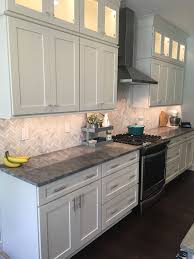 White Kitchen Marble Looking Granite Honed Marble Backsplash Herringbone Stainless Steel Ho White Kitchen Rustic White Kitchen Cabinets Diy White Kitchen Decor