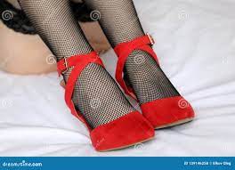Female Legs in Black Fishnet Stockings and Red Shoes on High Heels Stock  Photo - Image of lace, bedroom: 139146258