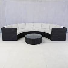 How about doing it differently outside with a rattan daybed, 'l' shaped design or a set with a fire pit table? Bulgari Black Rattan Curved Sofa Hire Rio Lounge