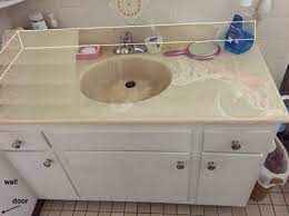 The mirror does not sit flush against the wall due to the hanging brackets used. 48 Vanity Top Sink Flush To Wall On Left Side