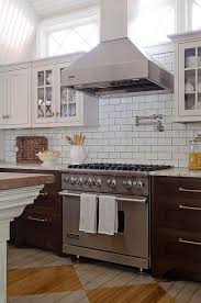 Brown fantasy hard marble countertop can carry brick backsplash or subway tile very well while white kitchen cabinetry is chosen. Kitchen With Viking Hood And Range Transitional Kitchen