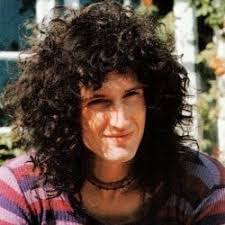 Brian May in that purple striped shirt because I'll never be over it