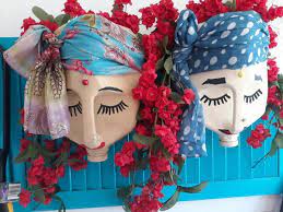 Line the bottom with recycled bottles filling approximately 1/3 of the container for plants and flowers. Recycled Milk Bottle Lady Planters Craftbits Com