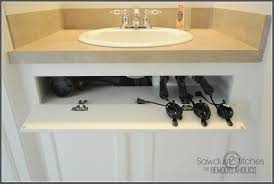 Astounding home depot bathroom cabinet design tool and interior. Remodelaholic Diy Under The Sink Hair Tool Storage