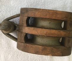An assembly of blocks with a rope threaded through the pulleys is called tackle. Vintage Wooden Block For Block And Tackle