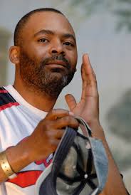 Image of Heavyweight boxer Mike Tyson flexes his muscles during the weigh