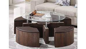 Coffee tables can add different textural elements to your room, depending on the style, since they can be made from glass, wood or metal. Cermak Glass Coffee Table With Ottomans