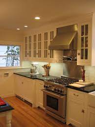 Darker cabinets and countertops combined can be fantastic as well, like this kitchen featuring cosmic black granite and dark wood finished cabinets. Absolute Black Granite Cottage Kitchen Hgtv