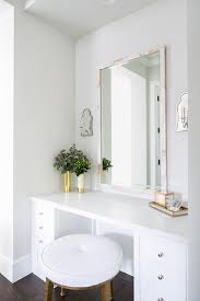 This custom vanity was built to include the makeup counter in between the two sink areas. White Built In Makeup Vanity With Capiz Mirror Transitional Bathroom