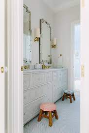 Then, hang a large mirror on the wall and add a lamp that is both practical and decorative. Jack And Jill Bathroom Design Ideas