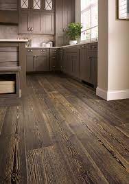 The deep, creamy shape pops against the dark floor, and the chairs bring great variety to the setup. A New Flooring Recipe To Try In Your Kitchen Flooring America