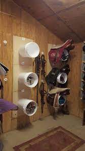 This wall mounted saddle rack is perfect and has storage space for grooming supplies! Facebook