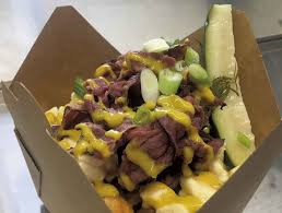 Packing around 740 calories and 41 grams of fat per serving, poutine is a slurry of french fries, basic brown gravy and fresh cheese curds, or squeakies, as canadians like to call them. Vulgar Display Of Poutine Opens In Island Pond Food News Seven Days Vermont S Independent Voice