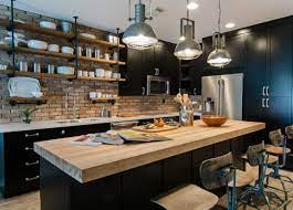 Wooden cladding covers up the exterior wall that completes the glass wall of this building. One Color Fits Most Black Kitchen Cabinets