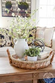 This antique coffee table has simple decor with organizing baskets below and a small stack of books on top. Impeccable Coffee Table Decor For Your Stylish Home Glaminati Com