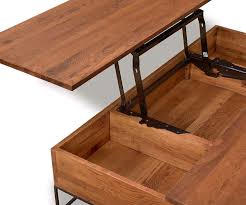 The coffee table offers adequate storage space as it comes with top drawers and an open bottom shelf that enables you to organize your place thus bringing a sense of order by preventing any cluttered. Leende Lift Top Storage Coffee Table Dania Furniture