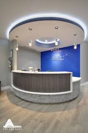 Blue And Stone Modern Reception Desk Dental Office Design By Arminco Inc Medical Office Decor Medical Office Design Dental Office Design