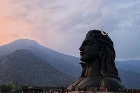 Offering a variety of programs that provide methods for anyone to attain physical, mental, and spiritual wellbeing, it aims to enable people to deepen their experience of life, and reach their ultimate potential. Bathed In Dusky Hues He Looks Over The Green Mountains Adiyogi Dusk Mountains Hue Sunset Meditation Images Shiva Isha Yoga