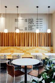 Barcelona S Bunsen Restaurant Embraces The City S Architectural Quirks Restaurant Seating Interior Comfy Living Room Furniture