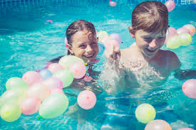 Prenses 61.760 views6 months ago. Boy And Girl In Swimming Pool Surrounded By Balloons Stockphoto