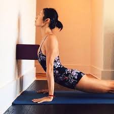 Using A Block To Lift The Sternum And Open The Chest Urdhva Mukha Svanasana Upward Facing Dog Iyengar Yoga Yoga Asanas Iyengar Yoga Wall Yoga