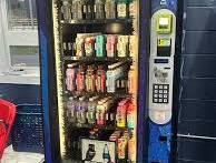 Why are some bottles placed upside down in this vending machine?