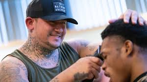 Barber Rich' delivers haircuts, life lessons during Titan Men of Diversity  Week