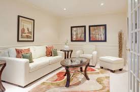 This Narrow Room Feels More Intimate With Bright Cream Paint On The Walls And The Addition Of A Flowing Geometrica Interior Design Narrow Rooms Living Room Designs