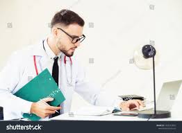 Doctor At Office Table In The Hospital With Patient Health File Medical And Healthcare Concept Ad Ad Hospital Pat Hospital Business Card Mock Up Doctor