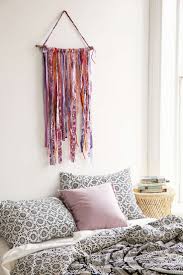 Floral wallpaper, macramé wall decorations, woven basket wall decor, mudcloth wall decor, tapestries, metallic mirrors, carved wood accents, bamboo wall decor, feather decor, crochet dream catchers, and eclectic art. Magical Thinking Quetzal Yarn Wall Hanging Bohemian Bedroom Boho Bedroom Decor Boho Room