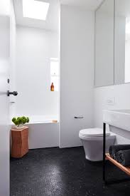 A Modest House For A Young Family In Sydney Black Bathroom Floor Black Bathroom Mosaic Bathroom Tile