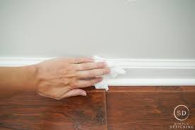 These old baseboards had layers of old paint drips on them, and lots of scratches and dents to smooth out, so i used an 80 grit sanding sponge to remove all the imperfections. How To Paint Trim Without Messing Up Your Walls And Floors