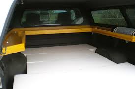 Learn how to ditch the traditional camping fridge slide and take back that precious interior space with this diy solution. 14 Camper Shell Interior Ideas For Comfortable Truck Camping The Wayward Home