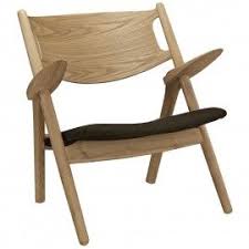 Its form and functionality have made it one of the most sought after pieces in modern history. Mid Century Modern Wooden Lounge Chair With Brown Fabric Seat Maple