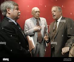 Gov. Phil Bredesen, right, talks with attorney George Barrett, center, and  attorney Ted Carey, both TennCare enrollee advocates, after Bredesen  announced that about 97,000 of TennCare's sickest enrollees will be able to