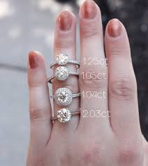 The surface area is 6.23x6.2mm. What Does 1 Carat Vs 2 Carats Really Look Like Visit Fink S Jewelers For The Round Diamond Engagement Rings Shop Engagement Rings Three Stone Engagement Rings
