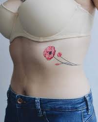 Like sky , there is no limit for rib tattoo themes and designs. Pink Flower Tattoo On The Rib Cage Tattoogrid Net