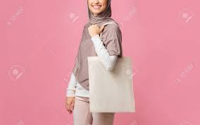 Download Unrecognizable Muslim Girl Holding Eco Tote Bag For Mockup Wearing Hijab Standing Over Pink Background With Empty Space Stock Photo Picture And Royalty Free Image Image 138656829