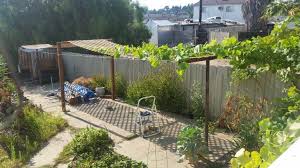The operator pulls the line to get clothes on the line closer and to bring an empty space within reach. Repurposing An Unused Clothesline The 50 Instant Patio Clothes Line Patio Backyard Makeover