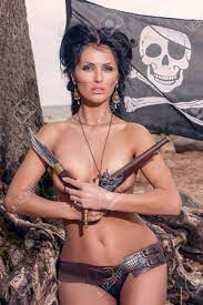 Topless Pirate Woman Covers Her Breasts With A Classic Pistols Stock Photo,  Picture and Royalty Free Image. Image 42835184.