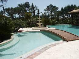 Footbridge Over Deep Pool Sans Fountain Grass Surrounding Casting Shadows Beneath Multidimensional Waters Swimming Pool Decks Pool Decks Pool Bridge