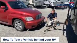 Towing 4 down is a popular way of flat towing a vehicle behind an rv. How To Tow A Vehicle Behind An Rv With A Blue Ox Tow Bar Youtube
