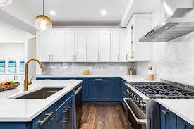 Contemporary kitchen features white shaker cabinets in island topped with white marble and two sinks illuminated by turquoise beaded chandelier. Standard Kitchen Island Dimensions With Photos Upgraded Home