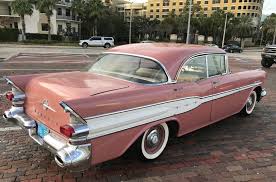 Image result for Carib Coral 1957 Pontiac