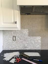 This will expose the sticky part of the mat that the backsplash tile will adhere to. How To Install A Mother Of Pearl Tile Backsplash