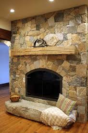Cozy living room with a stone wall. Choosing The Perfect Stone For Your Fireplace Stoneyard