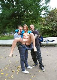 Blonde in blue coat flashing to group of strangers — Russian Sexy Girls